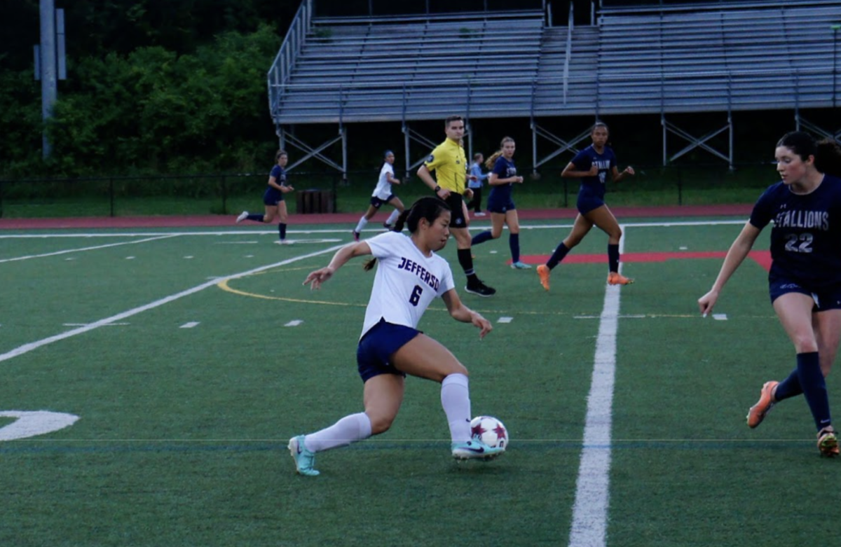 Working her way around multiple defenders, junior Anna Chau keeps the ball away from the opposing team while making her way to the goal. The players train weekly, even when they have two or more games a week. “During the regular season and even the preseason, we are working as hard as we can so that we can tone it down during the practices when all the games are like every other day,” Chau said. 